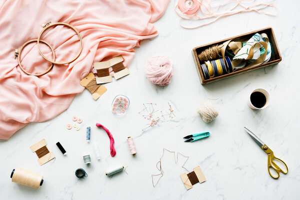 Simple craft materials arranged neatly on a table in a calm creative setting